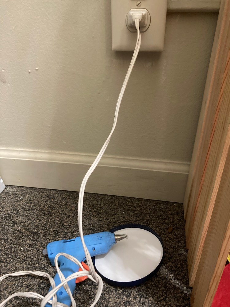 With a trusted adult, heat up the hot glue gun