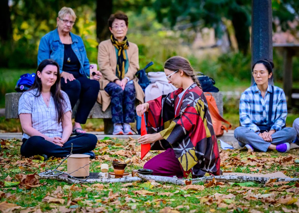 Professor Lindsey Stirek leads a Tea Ceremony to open the 2024 event. 