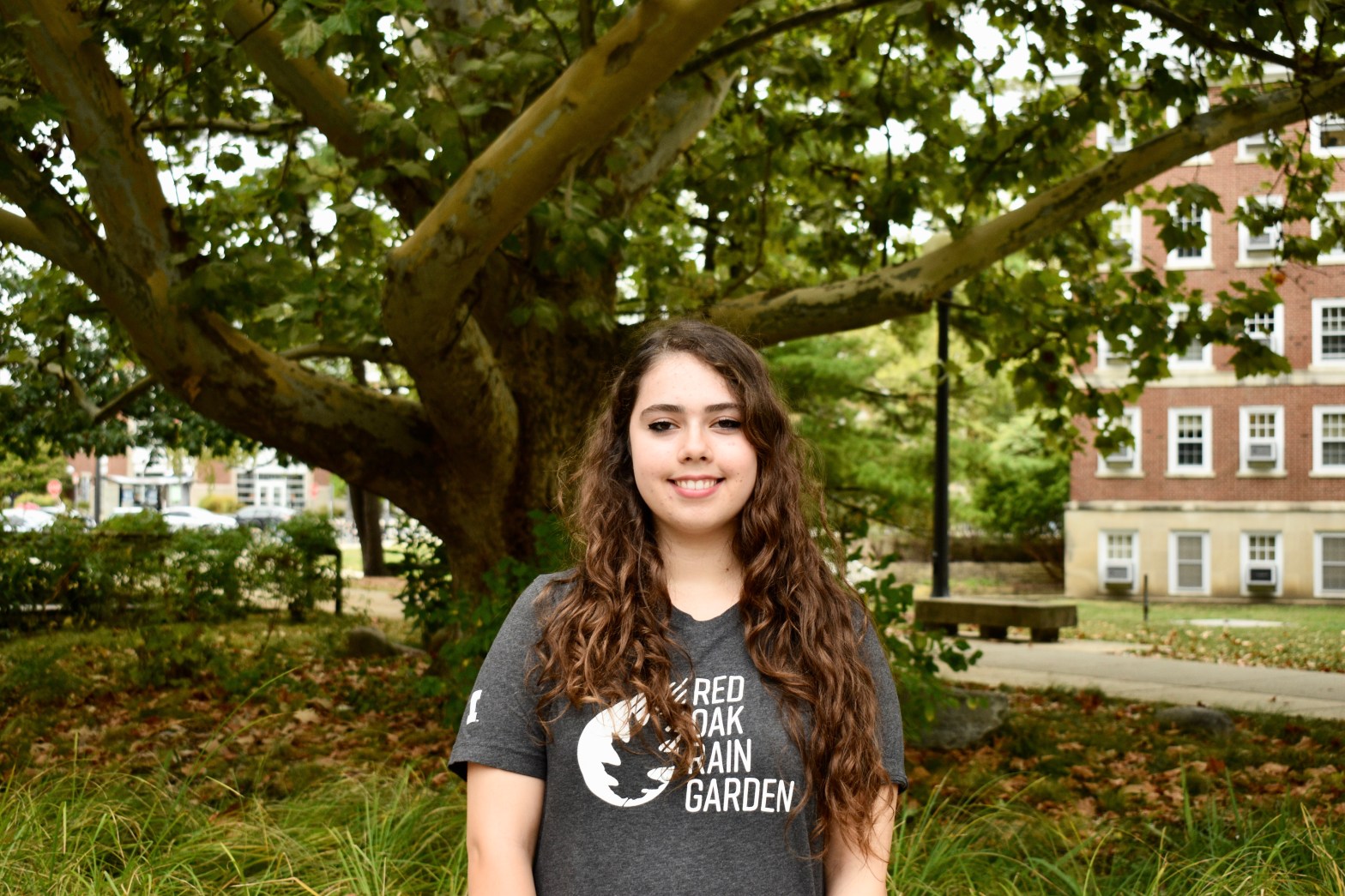 Jenna standing in front of the sycamore