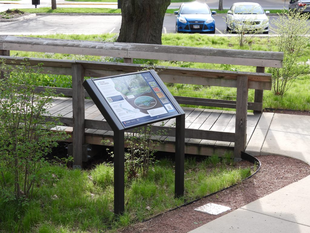 A newly installed interpretive sign at the Red Oak Rain Garden.