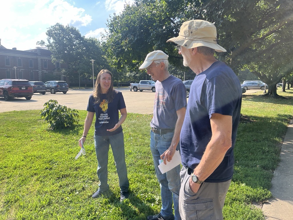 NREE Educator Karla Griesbaum talks to RORG volunteers during a mini-lesson on plant survival strategies.