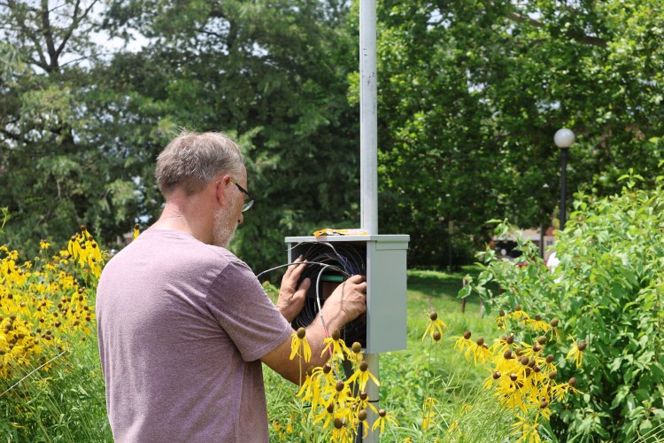 CEE Professor Art Schmidt setting wires at RORG's new monitoring station.